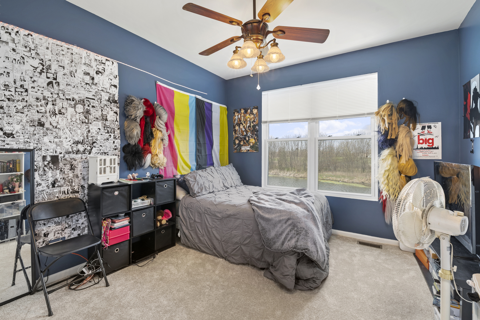 25420 Spring Street Manhattan, IL 60442 - Photo 19 of 27 a bedroom with a bed and a chandelier