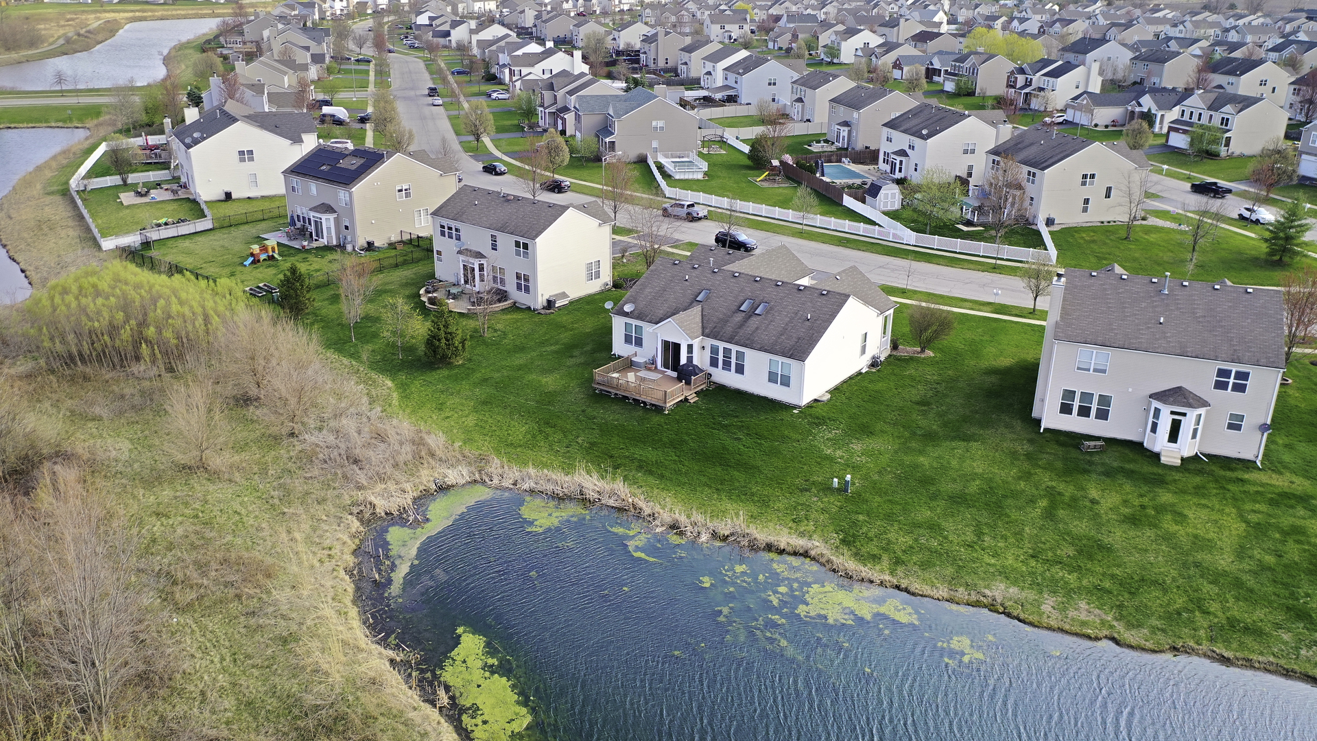 25420 Spring Street Manhattan, IL 60442 - Photo 24 of 27 an aerial view of a house with a garden and swimming pool
