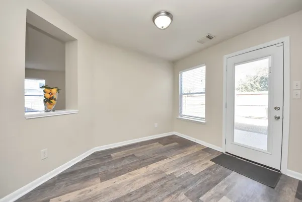 a view of an empty room with a window