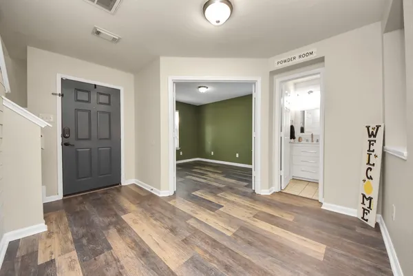 a view of empty room with window and stairs