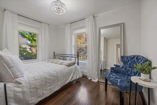 a bedroom with a bed and a table in it