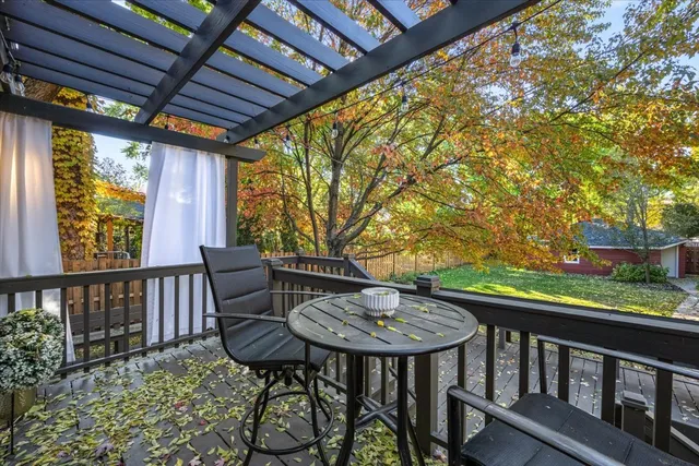 a view of a chairs and table in the balcony