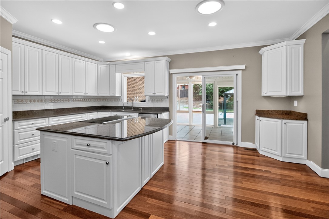 106 Newington Circle Anderson, SC 29621 - Photo 11 of 27 This bright kitchen features gleaming countertops, abundant cabinetry, and access to outdoor living.