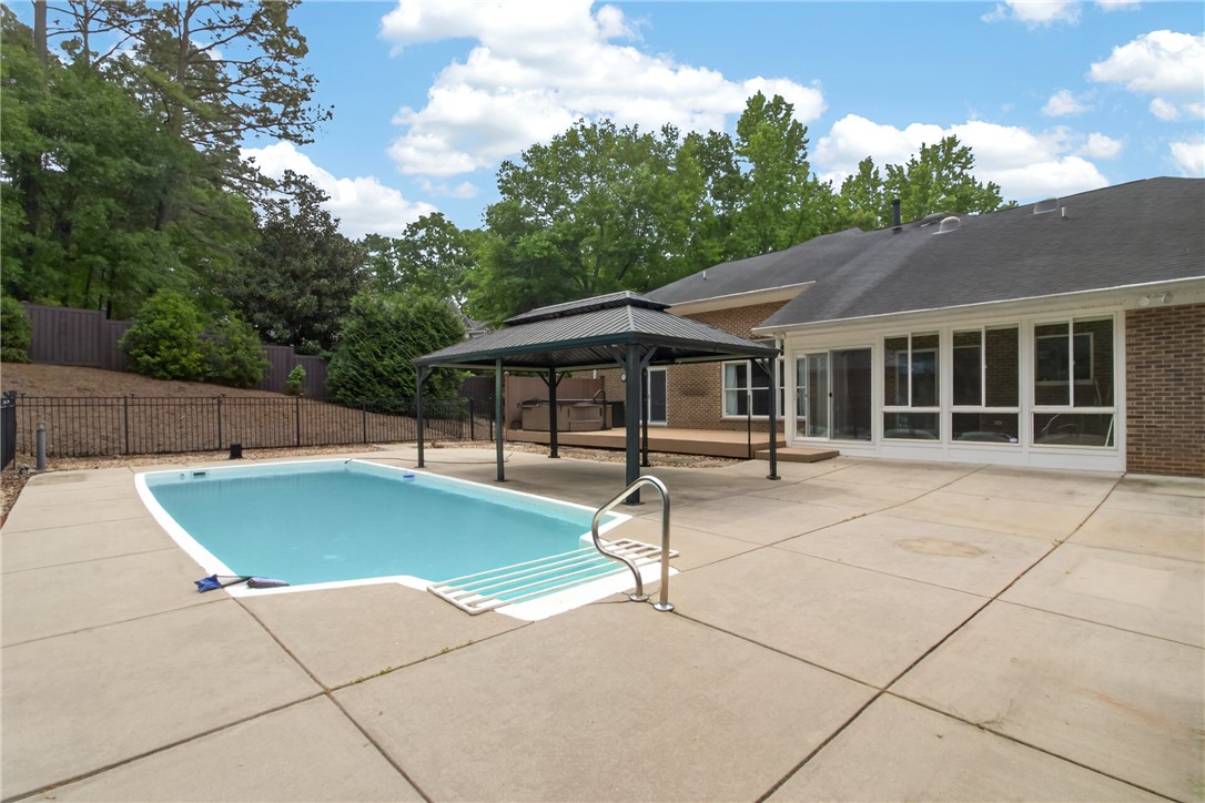 106 Newington Circle Anderson, SC 29621 - Photo 13 of 27 This private outdoor oasis features a refreshing pool and an inviting gazebo, perfect for relaxation.