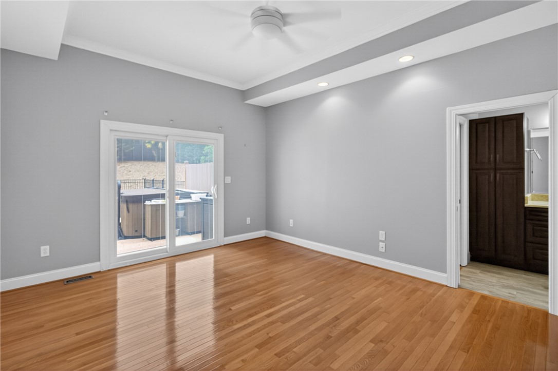 106 Newington Circle Anderson, SC 29621 - Photo 15 of 27 This spacious room features hardwood floors and convenient outdoor access to a private spa.