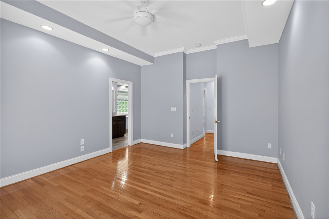 106 Newington Circle Anderson, SC 29621 - Photo 16 of 27 This spacious room features rich hardwood flooring and recessed lighting, offering comfort and style.
