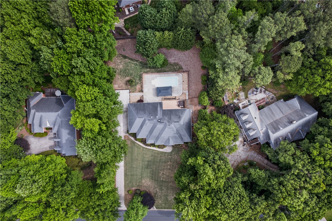 106 Newington Circle Anderson, SC 29621 - Photo 26 of 27 An aerial perspective reveals a home nestled among lush trees, featuring a serene private pool.