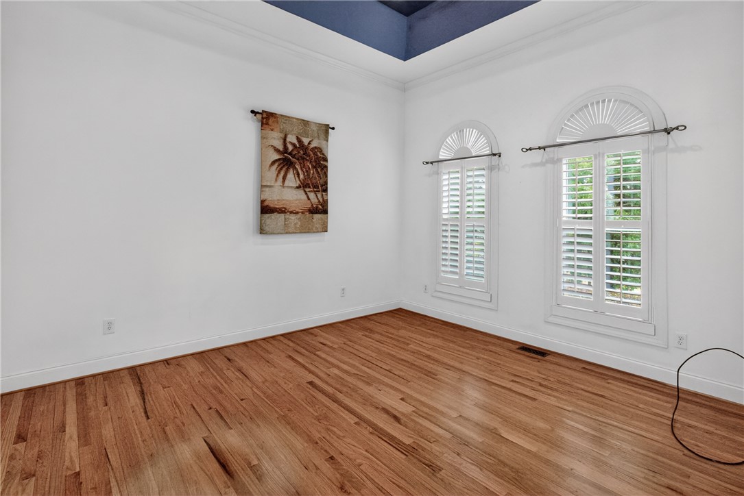 106 Newington Circle Anderson, SC 29621 - Photo 4 of 27 This bright room features beautiful hardwood floors and arched windows with plantation shutters.
