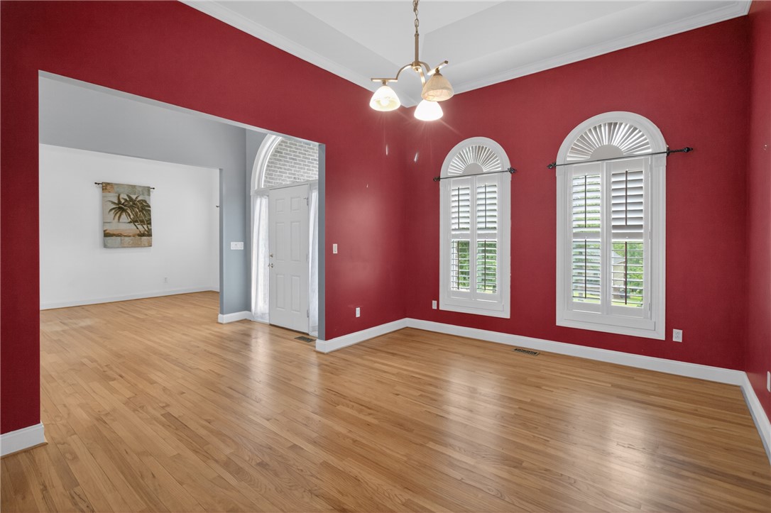 106 Newington Circle Anderson, SC 29621 - Photo 6 of 27 This inviting space features lustrous hardwood flooring and an elegant entryway, offering a welcoming atmosphere.
