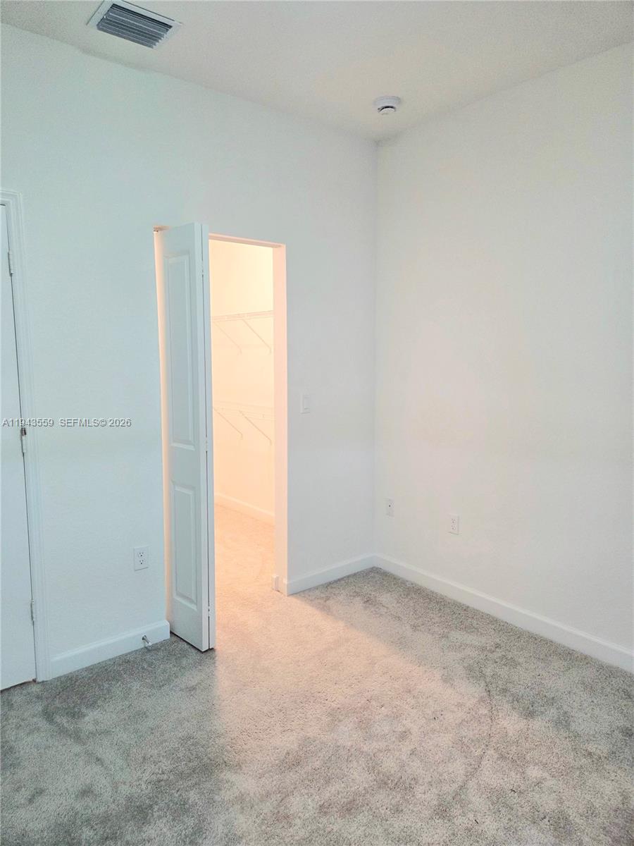 17925 Southwest 358th Street Homestead, FL 33034 - Photo 18 of 25 an empty room with a window