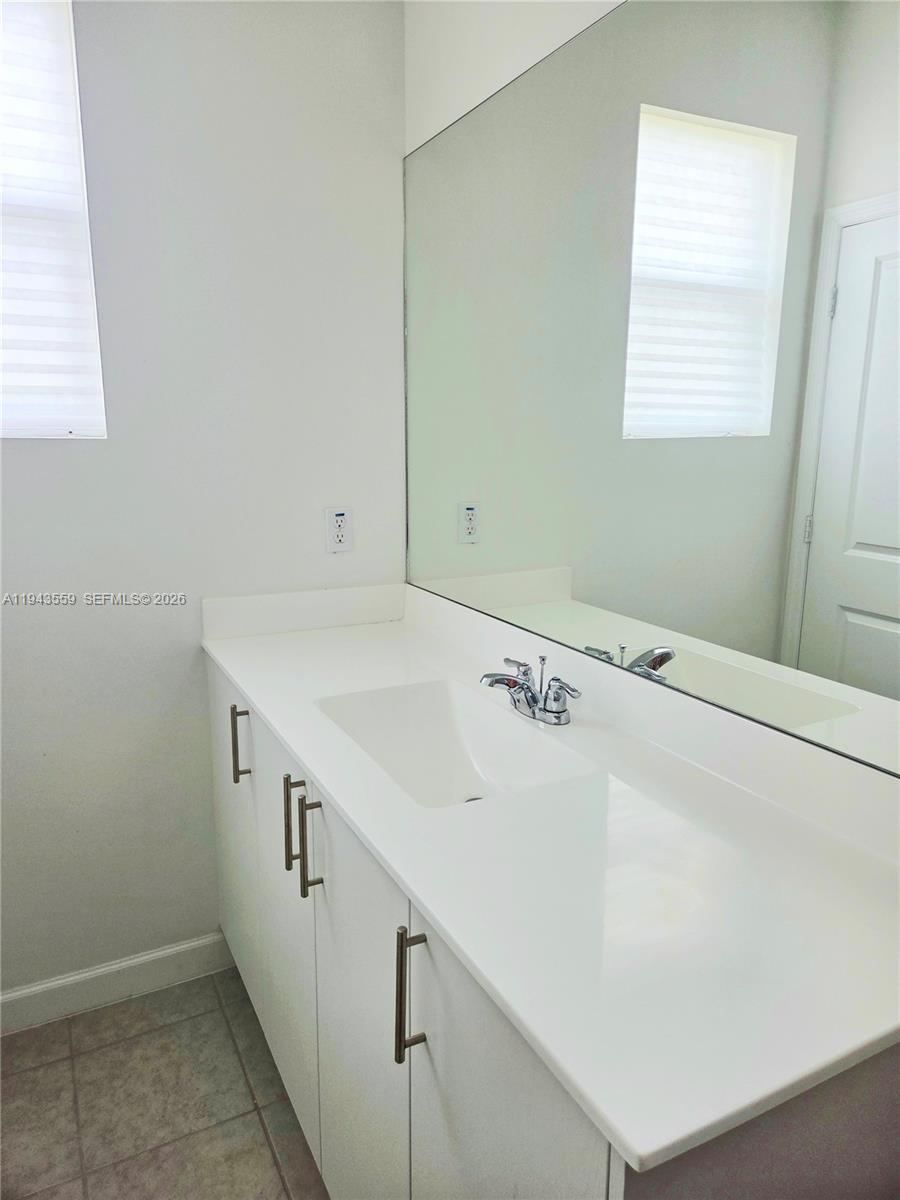 17925 Southwest 358th Street Homestead, FL 33034 - Photo 20 of 25 a bathroom with a sink and a mirror