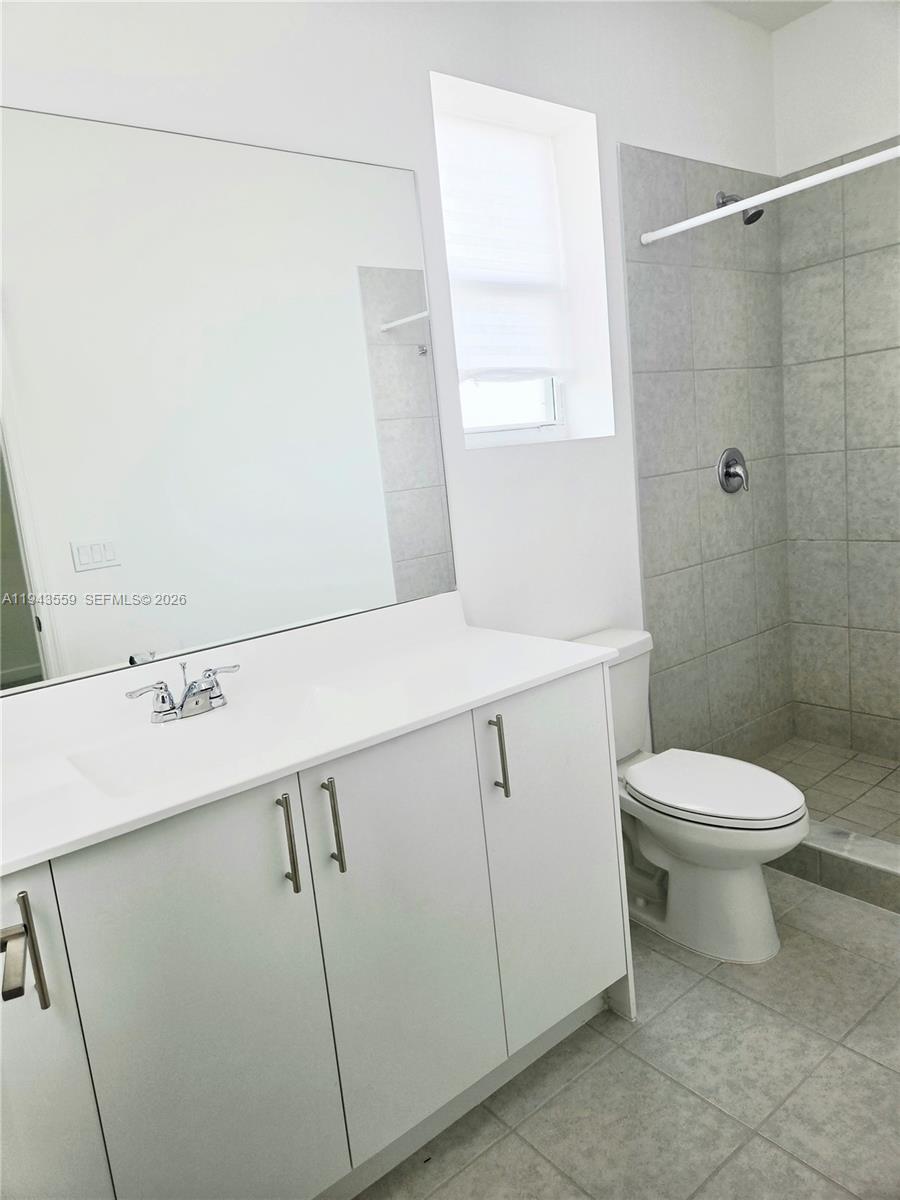 17925 Southwest 358th Street Homestead, FL 33034 - Photo 21 of 25 a bathroom with a sink a toilet and shower