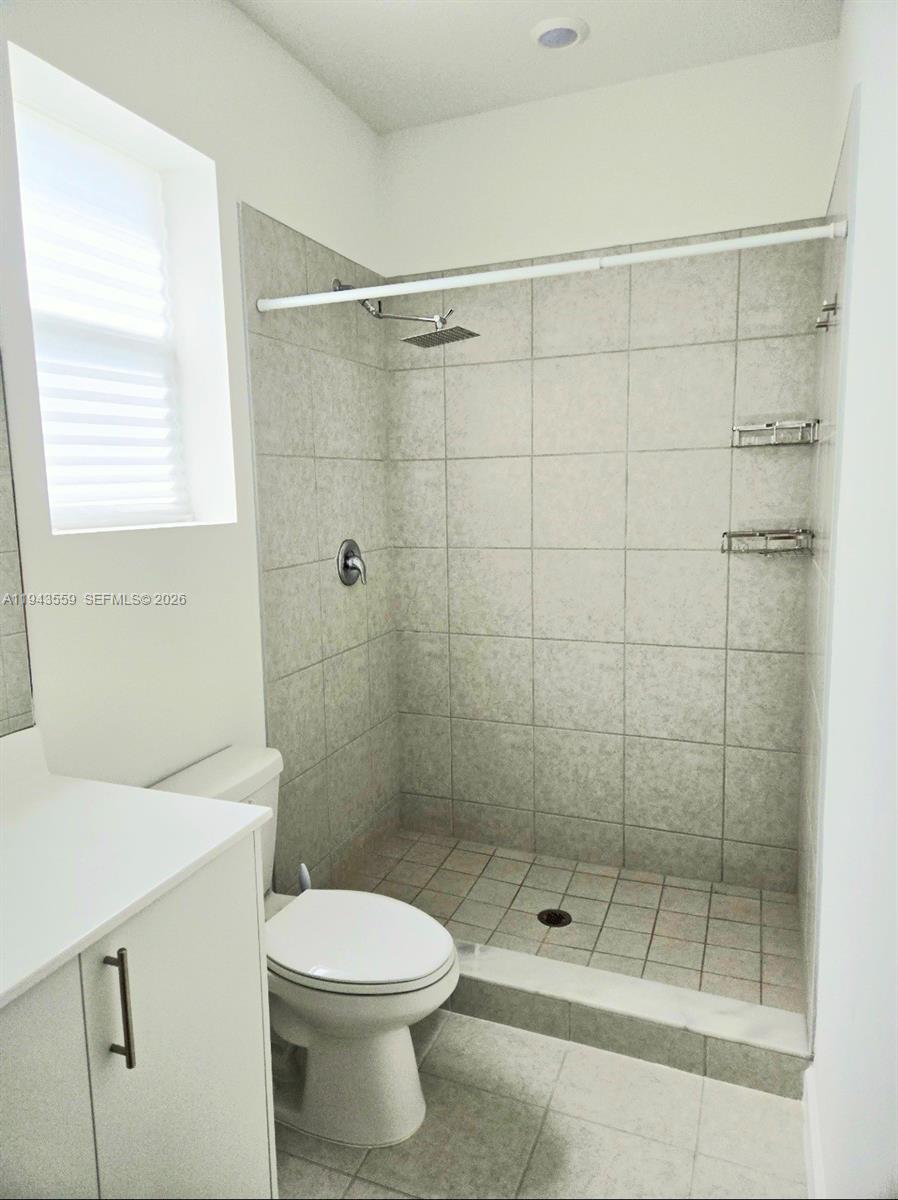 17925 Southwest 358th Street Homestead, FL 33034 - Photo 22 of 25 a bathroom with a shower a toilet and a sink