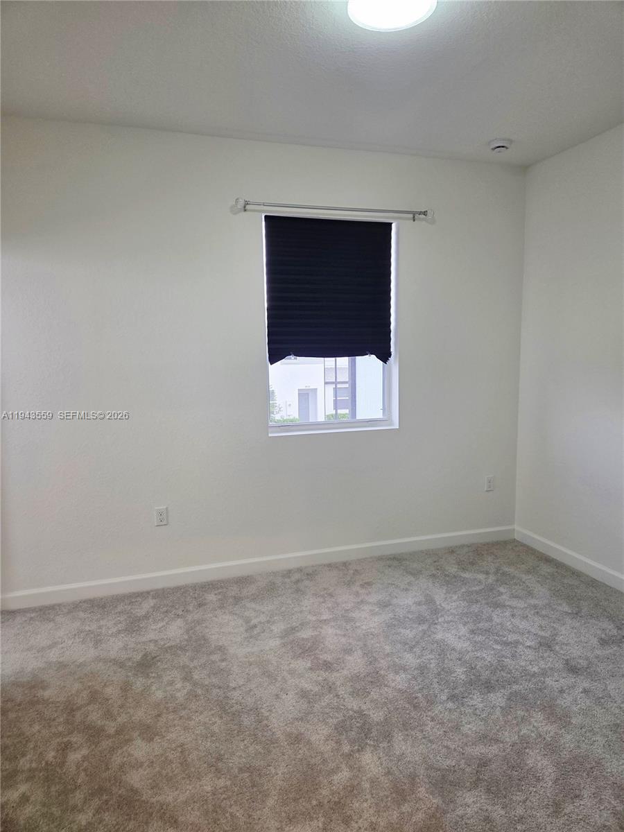 17925 Southwest 358th Street Homestead, FL 33034 - Photo 23 of 25 a view of an empty room with a window