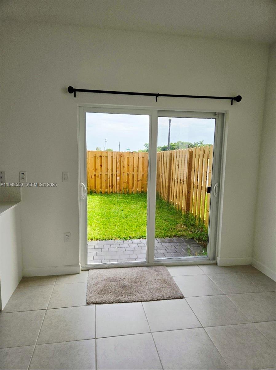 17925 Southwest 358th Street Homestead, FL 33034 - Photo 7 of 25 a view of a back yard from a room