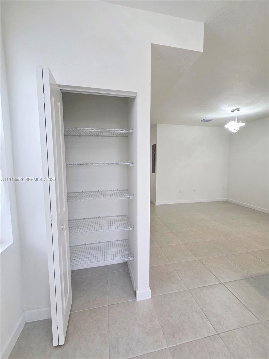 17925 Southwest 358th Street Homestead, FL 33034 - Photo 9 of 25 a view of an empty walk in closet