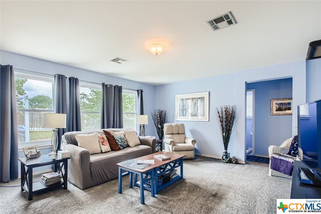 a living room with furniture and a window