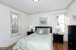 18 7th Street Northeast Washington, DC 20002 - Photo 11 of 27 a bedroom with a bed and wooden floor