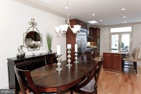 18 7th Street Northeast Washington, DC 20002 - Photo 20 of 27 a dining room with furniture and wooden floor