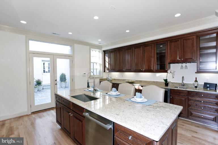 18 7th Street Northeast Washington, DC 20002 - Photo 3 of 27 a kitchen with a sink a stove and wooden floor