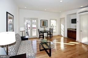18 7th Street Northeast Washington, DC 20002 - Photo 21 of 27 a living room with furniture and wooden floor