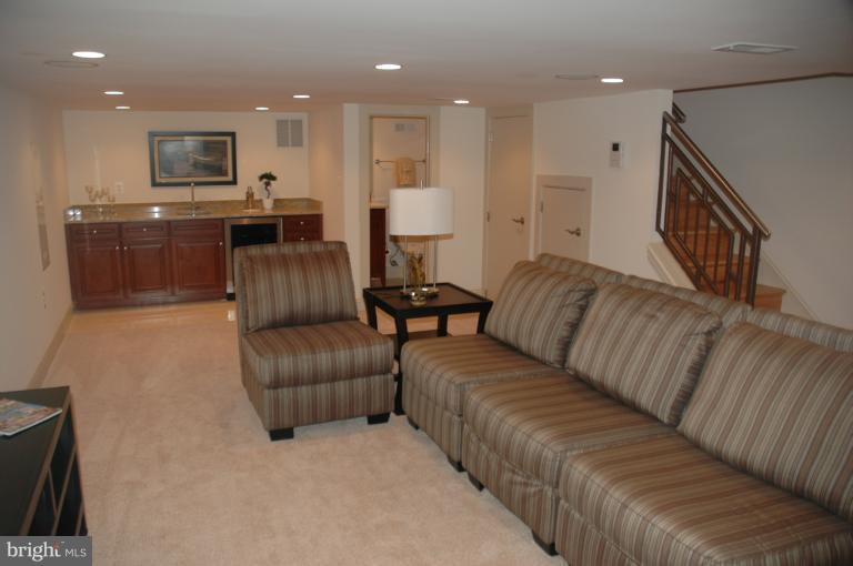 18 7th Street Northeast Washington, DC 20002 - Photo 26 of 27 a living room with furniture kitchen and a wooden floor