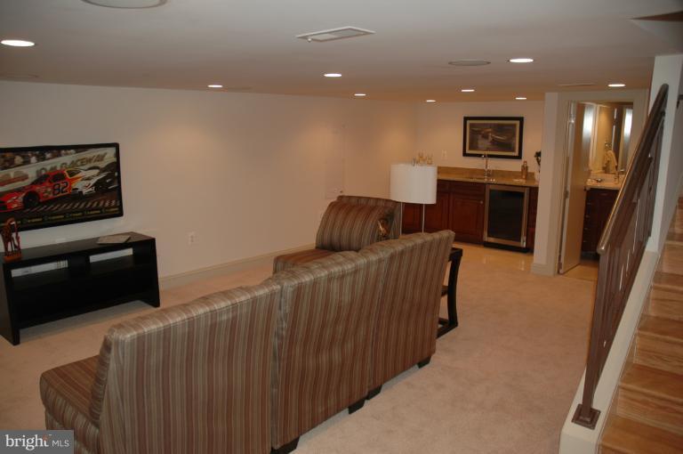 18 7th Street Northeast Washington, DC 20002 - Photo 8 of 27 a living room with furniture and a flat screen tv