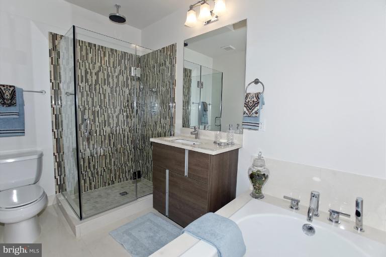 18 7th Street Northeast Washington, DC 20002 - Photo 9 of 27 a bathroom with a sink toilet and shower