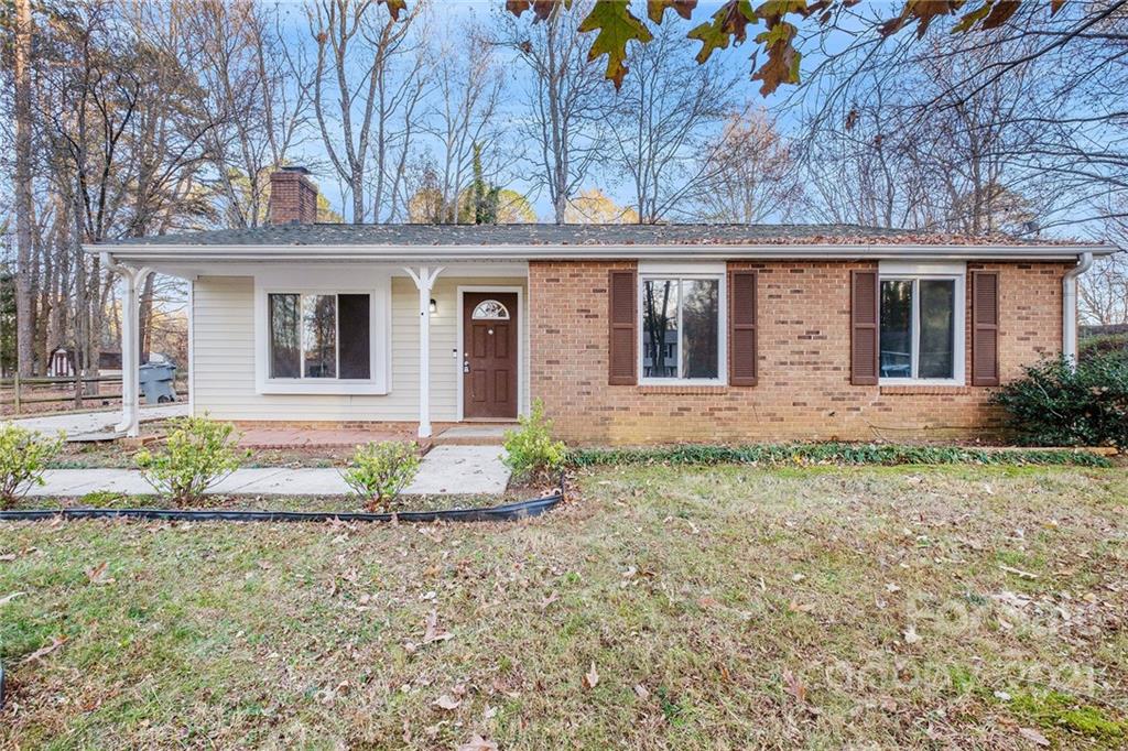 6217 Hickory Ridge Lane Charlotte, NC 28227 - Photo 2 of 15 front view of a house with a yard