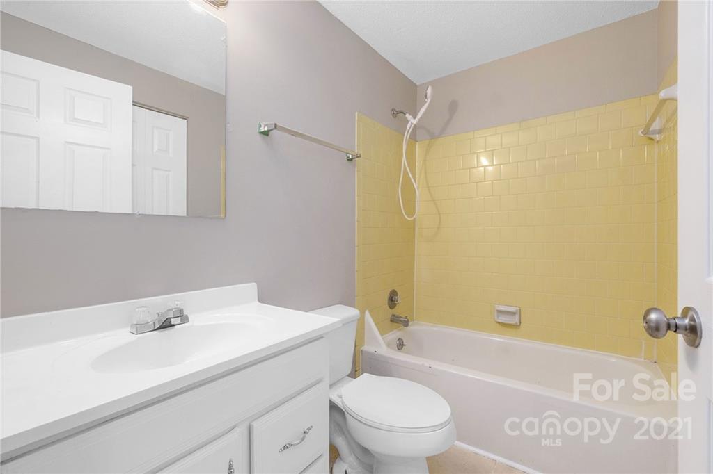 6217 Hickory Ridge Lane Charlotte, NC 28227 - Photo 11 of 15 a bathroom with a sink a toilet and shower
