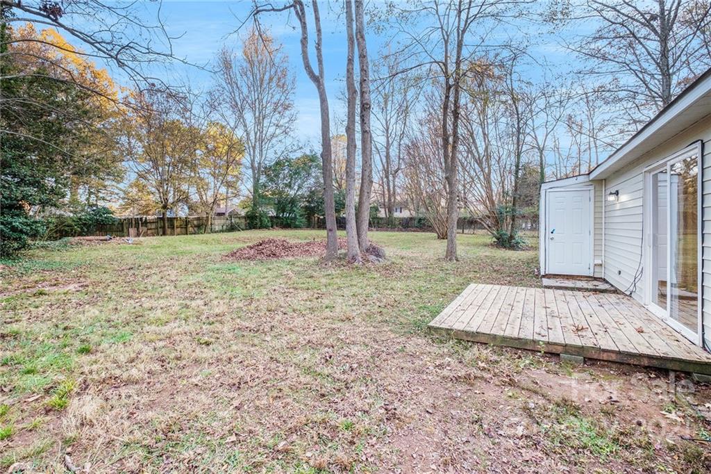 6217 Hickory Ridge Lane Charlotte, NC 28227 - Photo 15 of 15 a view of a backyard with large tree