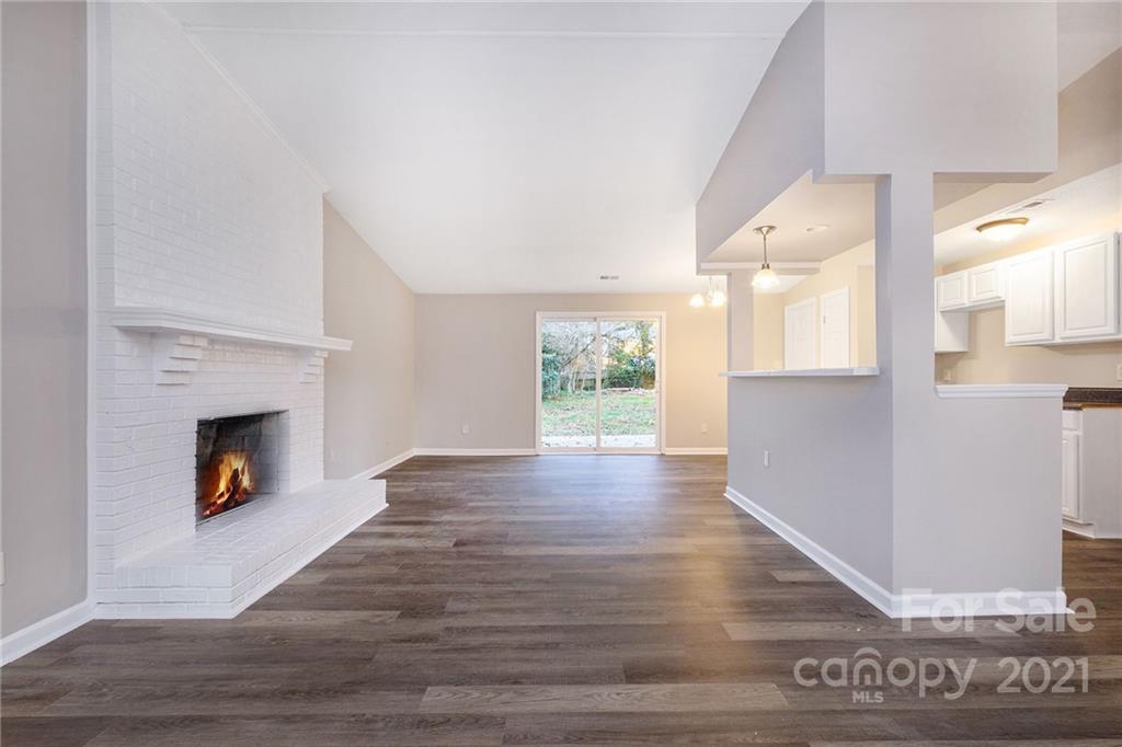 6217 Hickory Ridge Lane Charlotte, NC 28227 - Photo 3 of 15 a view of an empty room with wooden floor and a window