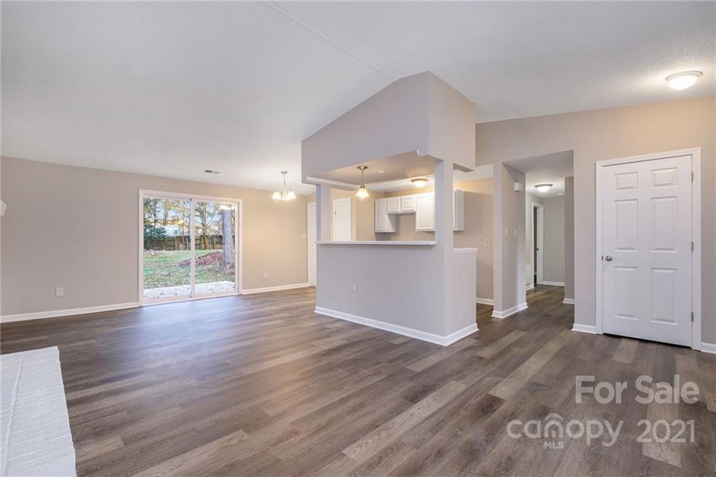 6217 Hickory Ridge Lane Charlotte, NC 28227 - Photo 4 of 15 a view of a big room with wooden floor and windows