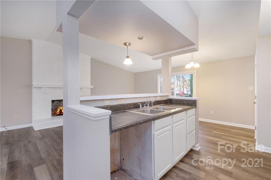 6217 Hickory Ridge Lane Charlotte, NC 28227 - Photo 5 of 15 a kitchen with a sink and cabinets