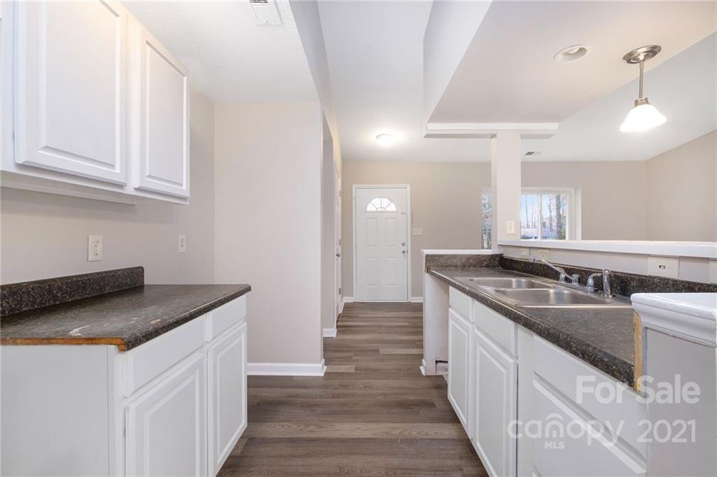 6217 Hickory Ridge Lane Charlotte, NC 28227 - Photo 6 of 15 a kitchen with stainless steel appliances granite countertop a sink stove and refrigerator