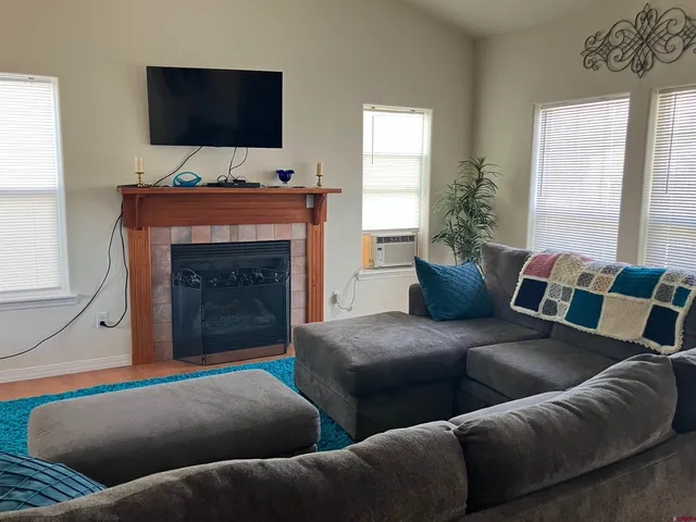 a living room with furniture and a flat screen tv