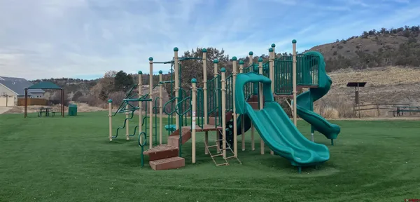 a view of a park with houses
