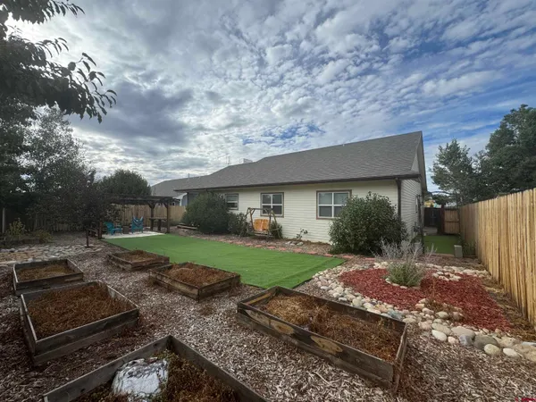 a view of a back yard of the house