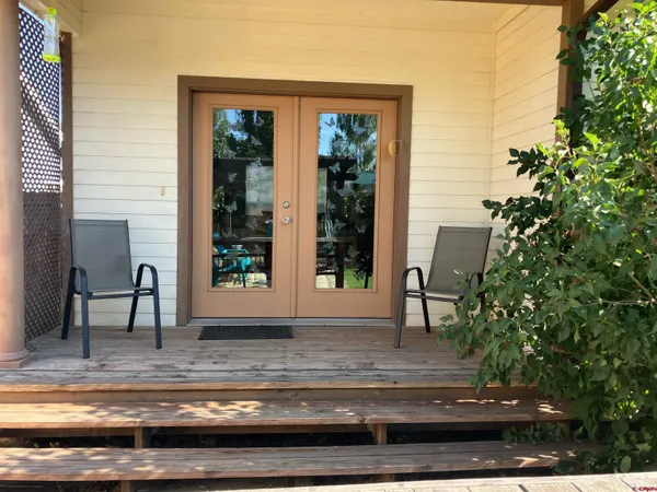 a view of front door and porch with seating space