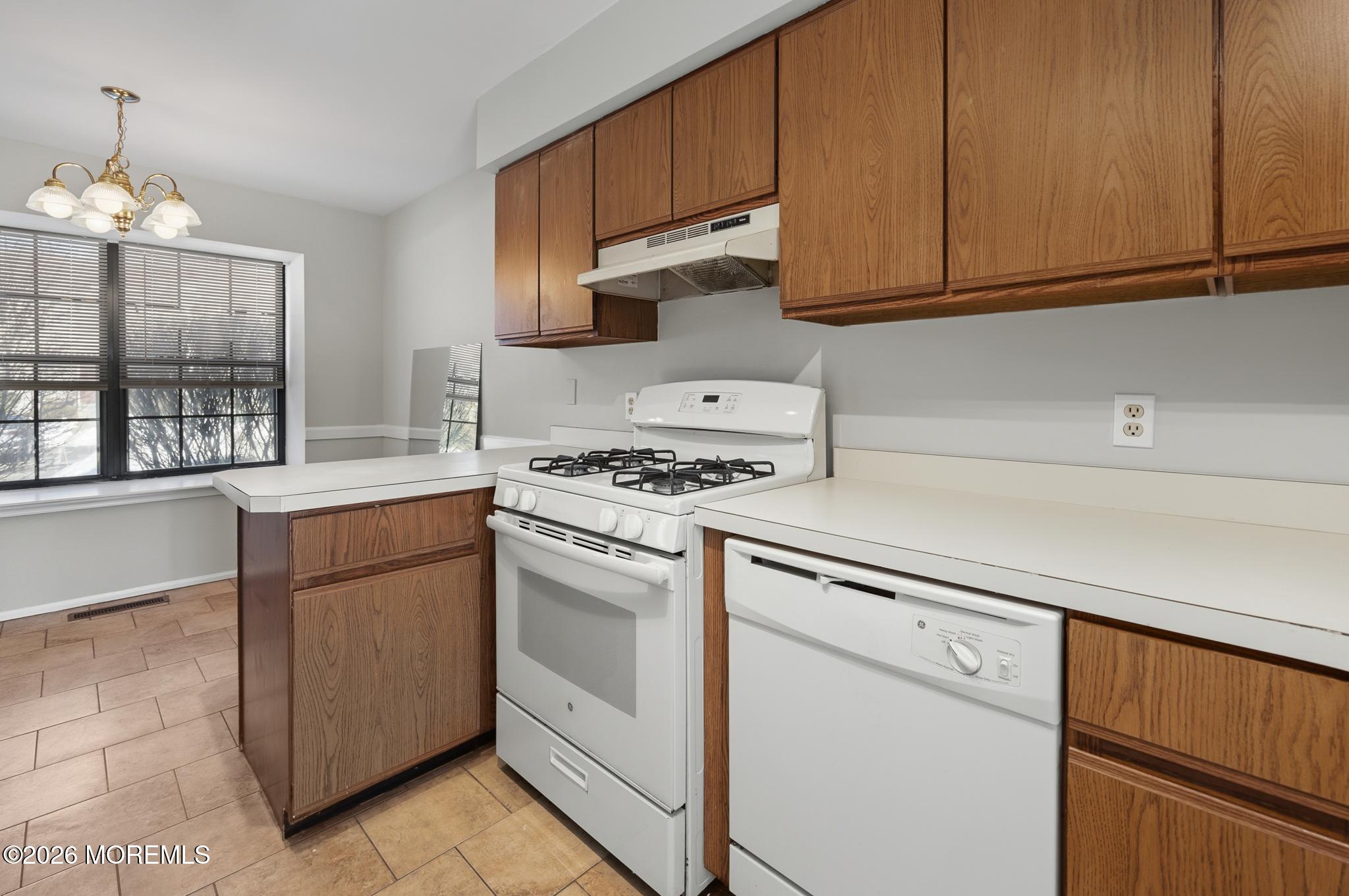 2305 Gulfstream Way Toms River, NJ 08755 - Photo 13 of 42 a kitchen with granite countertop cabinets stainless steel appliances and a counter space