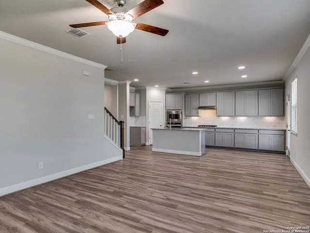 a view of kitchen with wooden floor and window