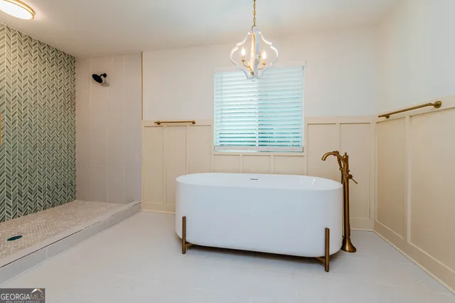 a bathroom with a shower a sink and a mirror