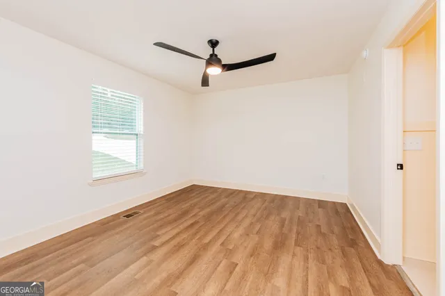 a bathroom with a double vanity sink toilet mirror and