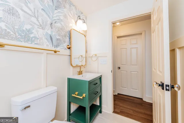 an empty room with a window and a ceiling fan