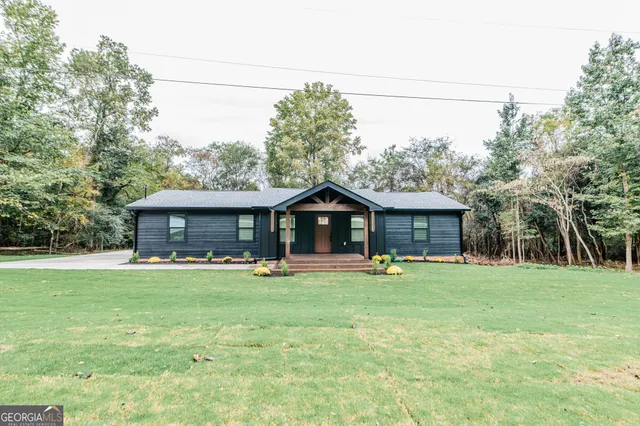 an aerial view of a house having yard