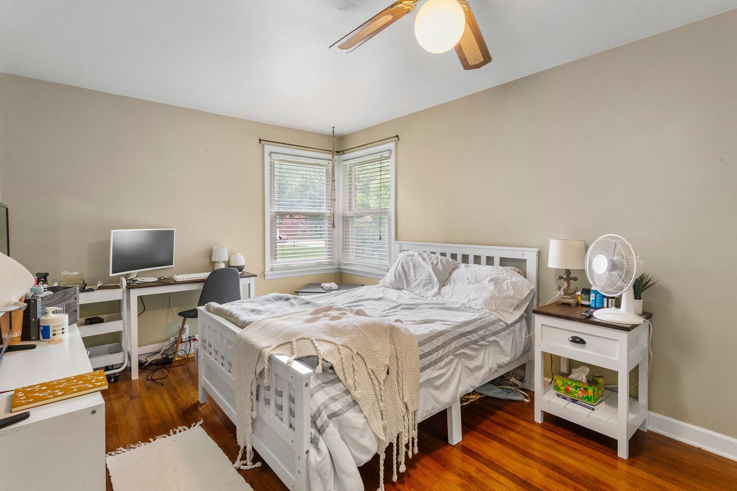 1117 West Union Street Champaign, IL 61821 - Photo 19 of 29 a bedroom with a bed and a flat screen tv