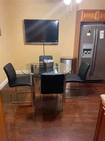 a living room with fireplace furniture and a flat screen tv