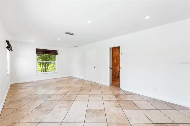 a view of an empty room and window
