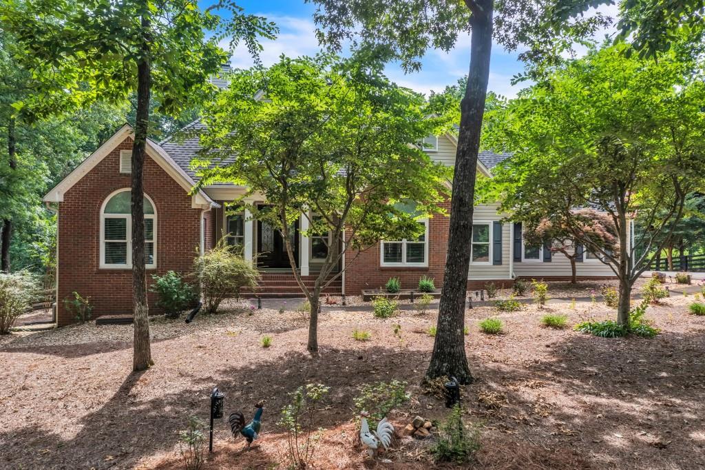 244 Bessie Lane Jasper, GA 30143 - Photo 1 of 1 a front view of a house with garden