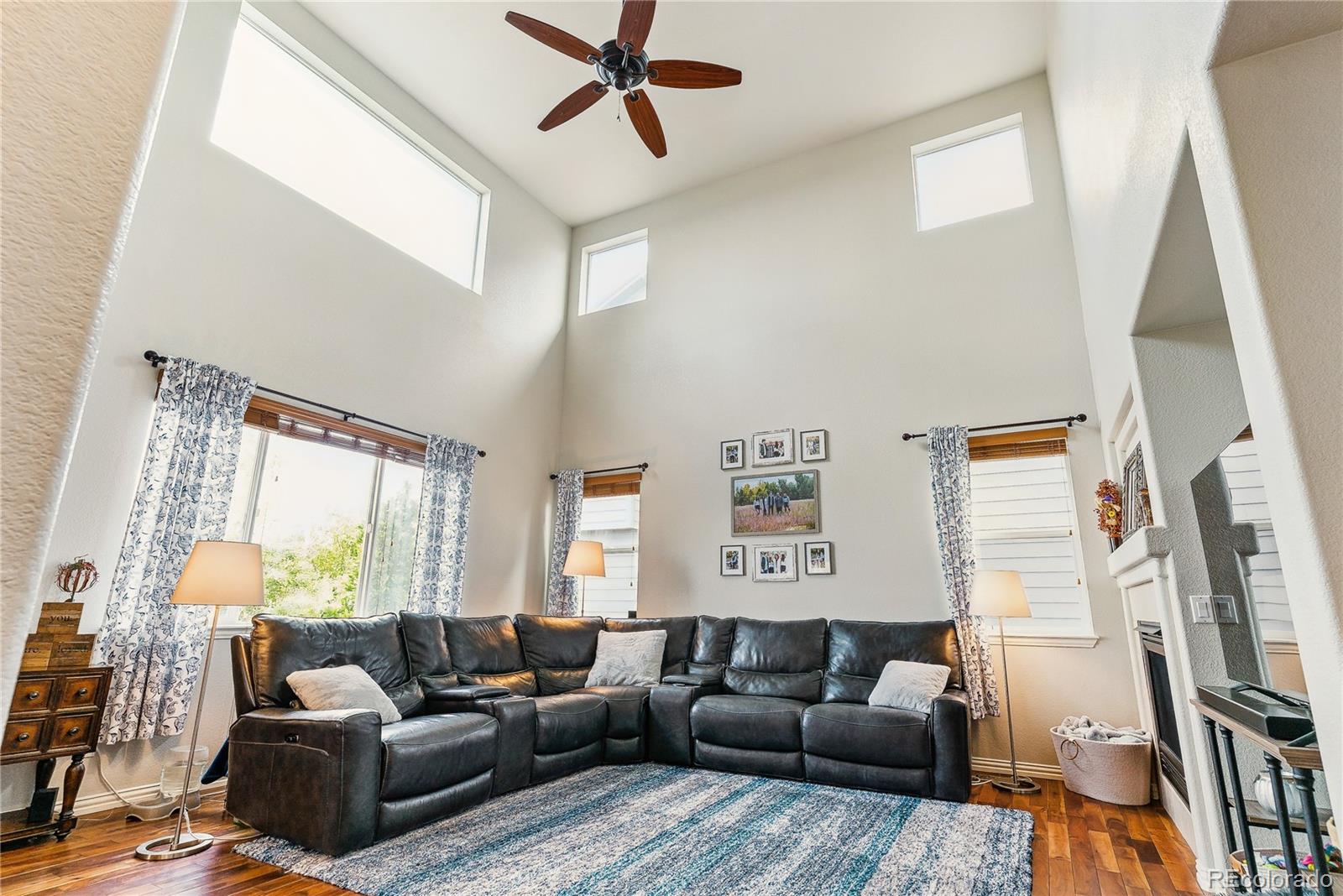 3477 Softwind Point Castle Rock, CO 80108 - Photo 12 of 50 a living room with furniture and a flat screen tv
